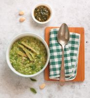 Asparagus and peas creamy risotto with almond and basil pesto